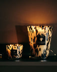 Baobab Black Pearls Candles Max 10 and larger size illuminated softly against dark background, evoking cosy elegance, available at Spacio India.