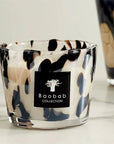 Close-up of Baobab Black Pearls Candle Max 10 showcasing artistic glass detailing on marble surface. Purchase online or at Spacio India stores.