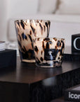Sophisticated Baobab Black Pearls Candle Max 10 lit on coffee table beside premium coffee table books, adding luxury to interior decor. Available at Spacio India.