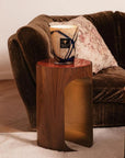 Sophisticated Baobab Stones Lazuli Candle Max 24 placed on a sculptural wooden side table in an elegant living room setting