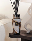 Elegant Baobab Stones Marble Diffuser Totem 2L placed beside contemporary decor, showcasing sophisticated glass craftsmanship and leather fragrance, available at Spacio India retail stores and online.
