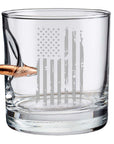 Clear whiskey glass with American flag engraving and bullet on a white background from the American brand Benshot available at Spacio retail stores in Mumbai & Kolkata.