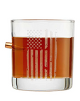 Clear glass with American flag design filled with bourbon whiskey on a white background