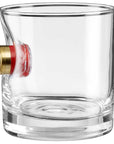 Clear glass with a shotgun shell bullet on a white background from the American brand Benshot available at Spacio retail stores in Mumbai & Kolkata.