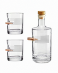 Clear whiskey glass decanter and two glasses with bullet on a white background from the American brand Benshot available at Spacio retail stores in Mumbai & Kolkata.