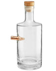 Clear whiskey decanter with a wooden cap and a copper bullet on a white background from American brand Benshot available at Spacio retail stores in Mumbai & Kolkata.