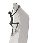 A Butzon Bercker sculpture of a man on a surfboard, representing the idea that everything is possible.