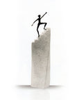 A Butzon Bercker Sculpture Steps to Success, depicting a man on top of a stair, symbolizing success and motivation.