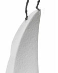 A Butzon & Bercker sculpture featuring a white shark tooth hanging on a string, transformed into an captivating artwork.