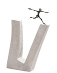 A Butzon & Bercker Sculpture Who does not Dare brand sculpture of a brave man running on top of a concrete block showcasing inspiring art.
