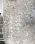 A handcrafted Italian fresco artwork depicting a rustic staircase against textured walls, made with Carrara marble and Roman travertine powder.