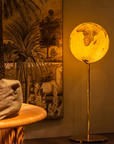 Illuminated Columbus Royal Floor Globe in a warm modern interior available at Spacio India from Office Accessories Collection.