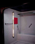 In the tube wall and vertical light from DCW Editions in a bathroom