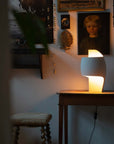 Sculptural table lamp from DCW Editions in a dark room