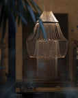A chandelier in a modern room interior from DCW Editions