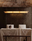 NL12 Suspension chandelier from DCW Edition above a dining table