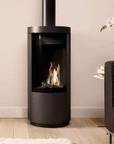 Indoor wood burning fireplace in a modern home