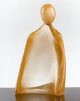 Glass sculpture of a man with 24K gold dust on a white background titled HIM from Duccio Di Segna, available at Spacio retail stores in Mumbai & Kolkata.