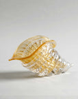 Elegant amber and gold cornucopia glass sculpture by Duccio Di Segna, crystal decor object showcased at Spacio India