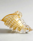 Diagonal view of handcrafted amber-gold crystal cornucopia sculpture by Duccio Di Segna at Spacio India