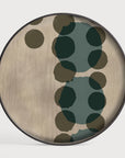 Round wooden wall art panel cum serving tray with green and brown polka dot pattern on a white background