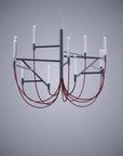 Modern chandelier with red cables on a gray background