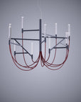 Modern chandelier with red cables on a gray background