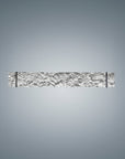 Decorative wall sconce with intricate design on a gray background