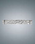 Decorative wall sconce with intricate design on a gray background