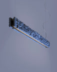 Modern pendant light fixture on a neutral background