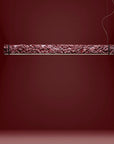 Decorative suspension light fixture on a dark red background