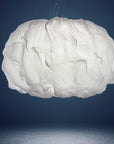White cloud-shaped lamp against a dark blue background