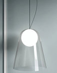 Modern pendant light with a clear glass shade on a gray background