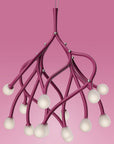 Pink chandelier with multiple light bulbs on a pink background
