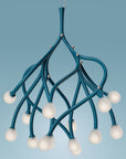 Modern teal chandelier with white bulbs on a blue background
