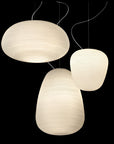 Three pendant lights with a textured design on a black background