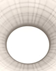 Close-up of a white ceiling light fixture with geometric design