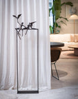 A living room with Love Birds curtains and a Gardeco Bronze Sculpture Love Birds (Limited Edition) by Gardeco.
