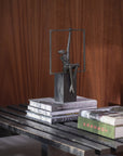Abstract sculpture on books with a wooden background