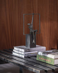 Abstract sculpture on books with a wooden background