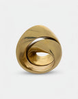 Gold finish sculpture with a unique design on a light gray background