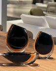 Three Gardeco Cance 160 Black Amber vases, sculptural objects that are sure to elevate the aesthetic of any room.