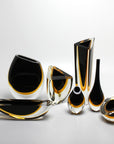 A collection of Gardeco Cance 160 Black Amber vases that can serve as a stunning focal point in a space with fresh flowers.