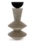 Decorative mixed media sculpture with a black metal and textured grey soap stone on a white background, from Gardeco available at Spacio retail store in Mumbai & Kolkata.