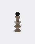 Decorative mixed media sculpture with a black metal and textured grey soap stone on a white background titled as Contantein Totem 04, from Gardeco available at Spacio retail store in Mumbai & Kolkata.
