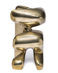 Polished bronze abstract sculpture on a white background