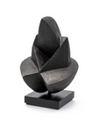 Black abstract sculpture on a white background