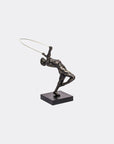 Bronze sculpture of a figure with a hoop on a white background