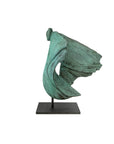 Abstract green sculpture on a white background