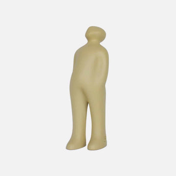 A small figurine of a man standing on a white background, created by Gardeco Ceramic Sculpture Visitor Small Sand Cor02, a Belgian sculptor.
